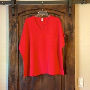 Barely worn Zenana oversized boxy blouse with pocket in front.